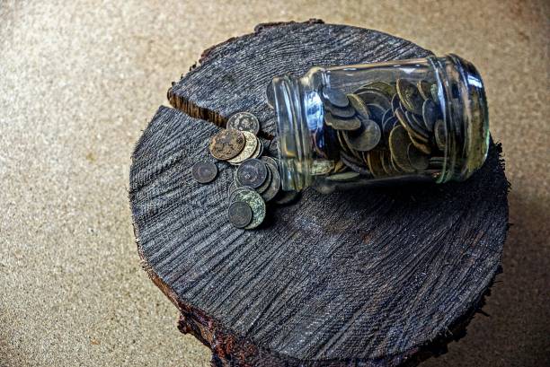 istock Glass jar with a trifle on a wooden stump 901920446