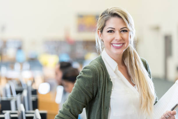 istock Portrait of confident librarian 901926172