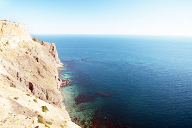 istock Sea with clear water and high rocky shore 901937870