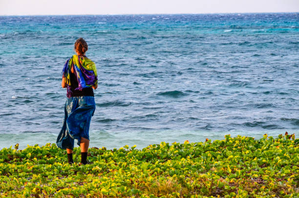 istock Woman on island shore 901938530
