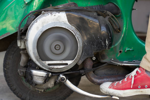 istock Kick Start A Very old Scooter with Two Stroke Engine And Ventilators Fan Spinning After Ignition. 901942380
