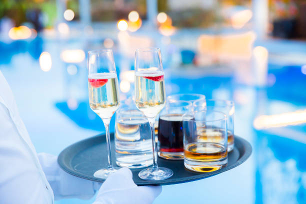 istock champagne on a tray with strawberry next to the pool 901944926