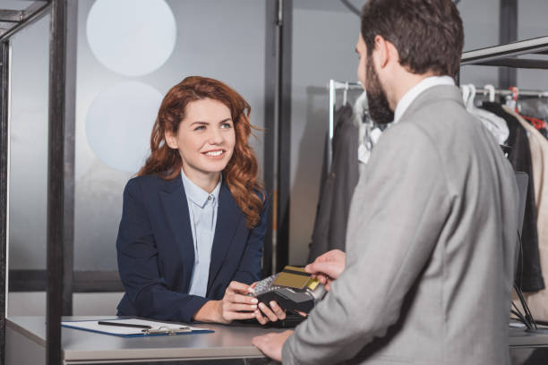istock man paying with contactless purchase at dry cleaning office 901948464