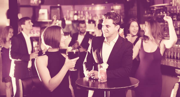 istock Colleagues communicate on corporate party 901949056