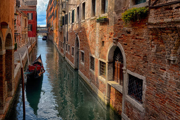 istock Gondolas on canal in Venice 901953586