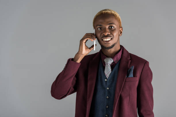 istock smiling african american man using martphone 901961182