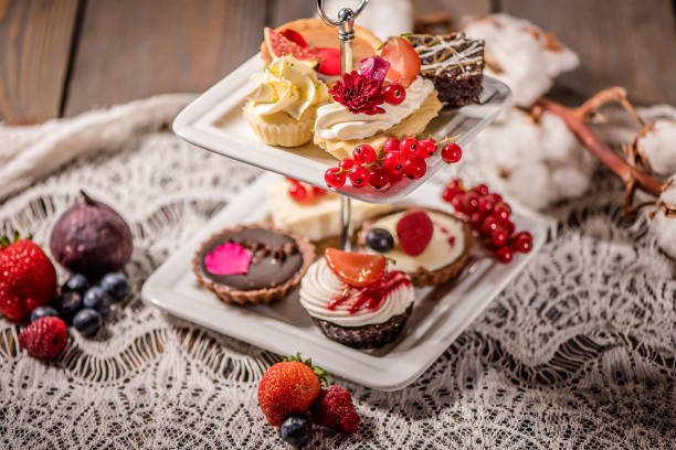 istock cake selection on white cake stand and wood background 901976850