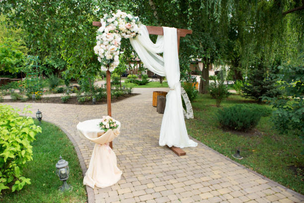 istock Wedding arch decorated with fresh flowers 901984218