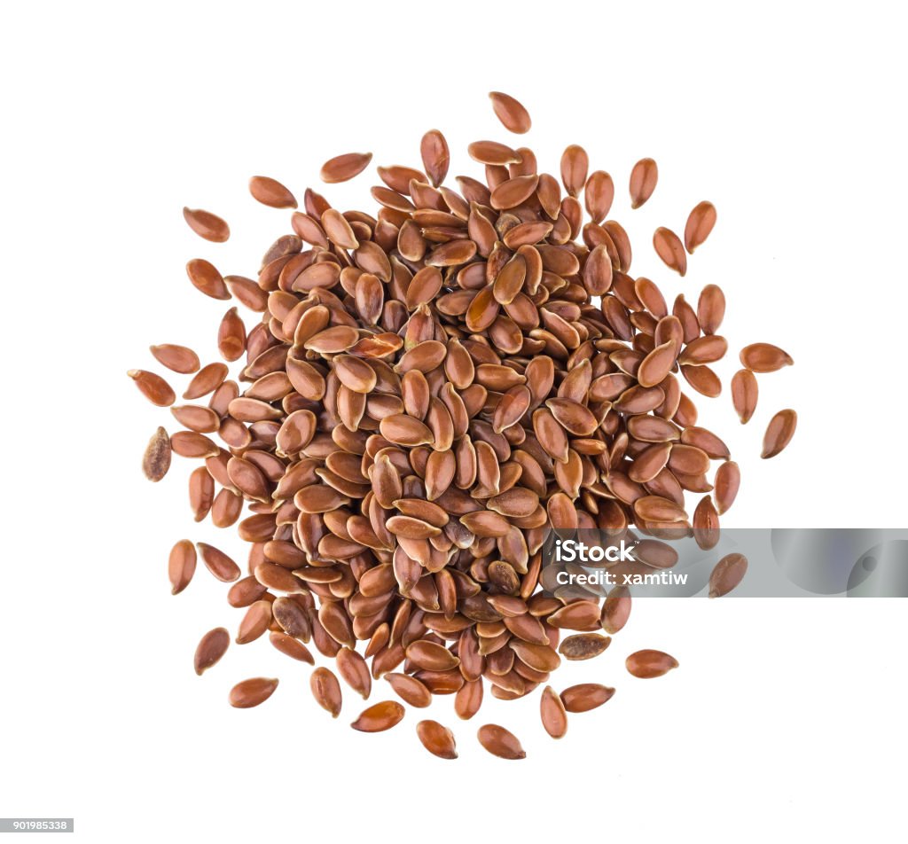 Pile of flax seeds on white background, top view Pile of flax seeds isolated on white background close-up, top view Flax Seed Stock Photo