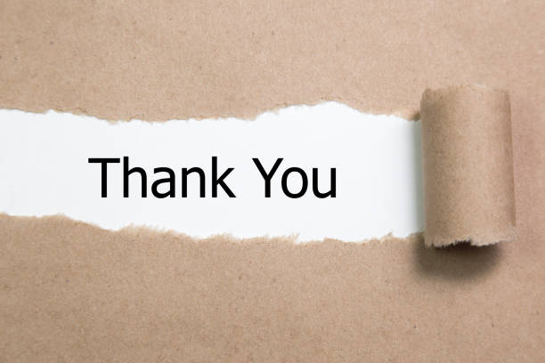 istock thank you word under torn paper 901987800
