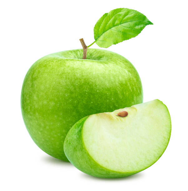 One green apple and quarter piece isolated on white background One green apple and quarter piece isolated on white background with clipping path green apple slice stock pictures, royalty-free photos & images