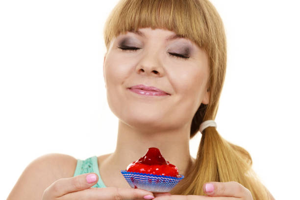 istock Woman holds cake strawberry cupcake 901992326