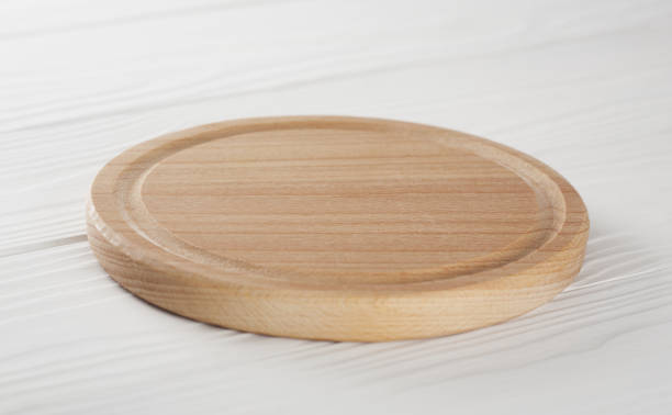istock wooden cutting board for food on the table 902003910
