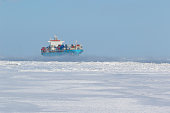 Container ship on icy waters