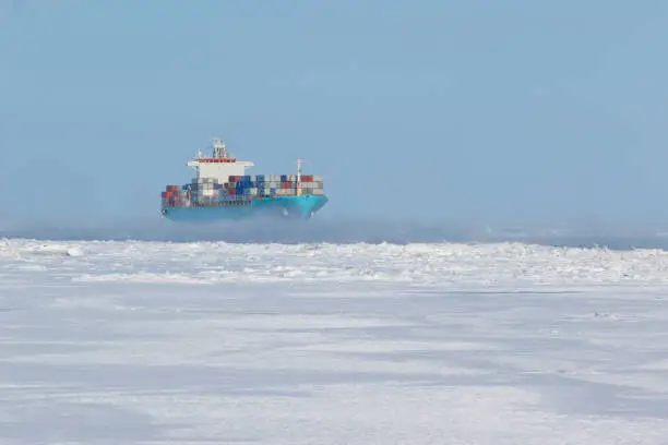 Photo of Container ship on icy waters