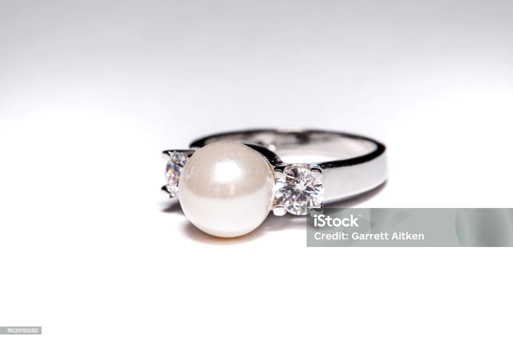 Pearl And Diamond Ring Vintage retro pearl and diamond engagement ring with a white background Beauty Stock Photo Pearl And Diamond Ring Vintage retro pearl and diamond engagement ring with a white background Beauty Stock Photo