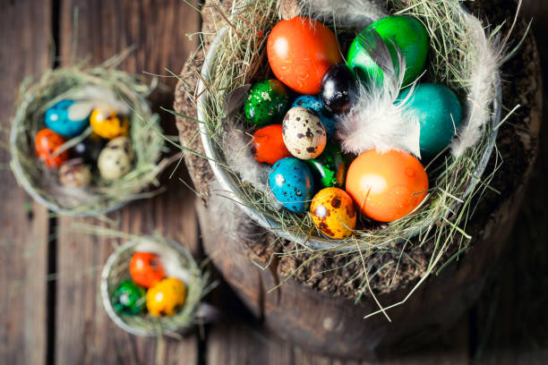 istock Colorful eggs for Easter in wooden small henhouse 902012914
