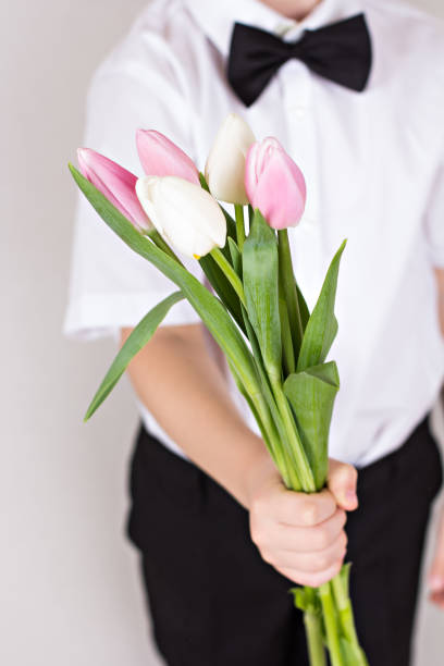 istock Bouquet of spring flowers in children's hands 902024544