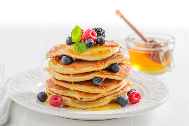 istock American pancakes for breakfast in the morning on white background 902024550
