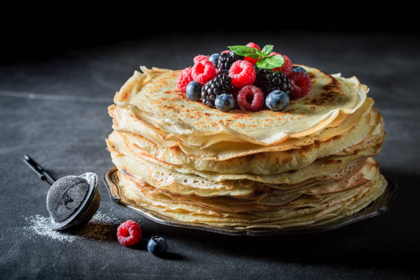 istock Big stack of pancakes with blueberries and raspberries 902024654
