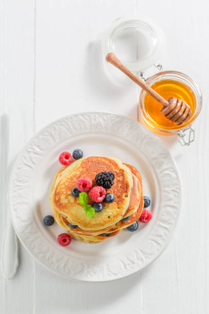istock American pancakes with blueberries, raspberries and mint 902027590