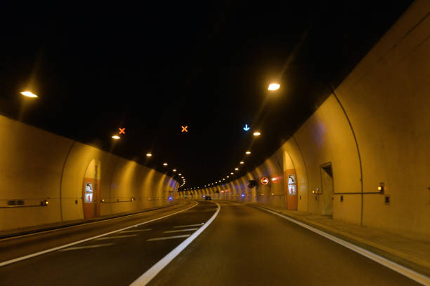istock tunnel in the mountains on the road 902027614