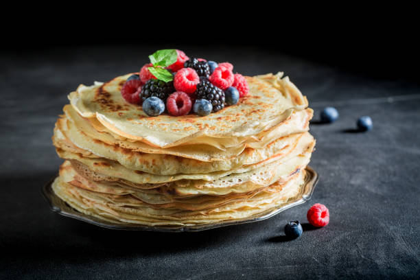 istock Pancakes cake with fresh berries and mint 902027700