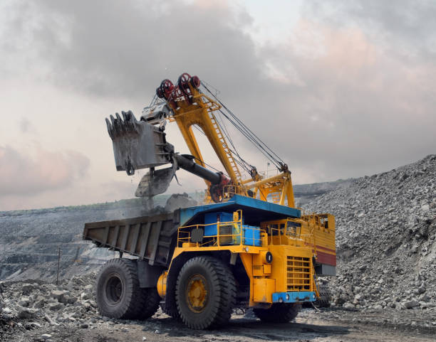 istock Loading of iron ore on very big dump-body truck 902030070