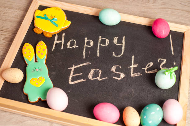 istock Easter composition of colored eggs, the Easter Bunny and the inscription 