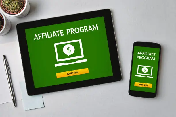 Photo of Affiliate program concept on tablet and smartphone screen