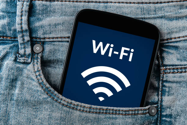 istock Free wifi concept on smartphone screen in jeans pocket 902074400