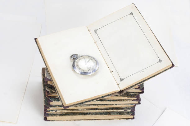 istock Old books with eye-glasses isolated on white background 902077248