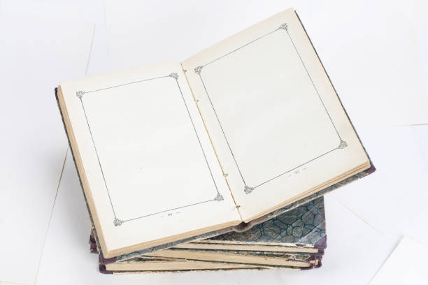istock Old books with eye-glasses isolated on white background 902077264