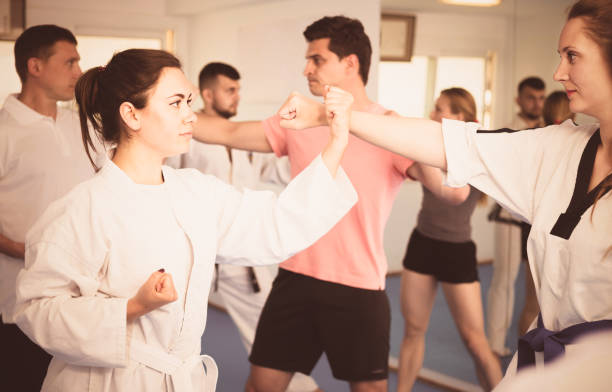 istock Adult trainees show their skills in training on karate 902078162