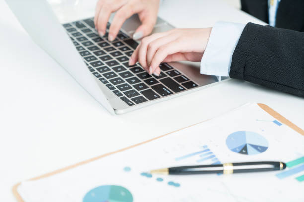 istock business woman working on laptop 902084010