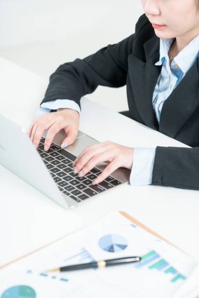 istock business woman working on laptop 902086590