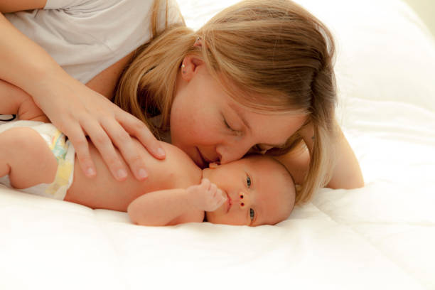 istock 15-days-baby with her mother 902106010