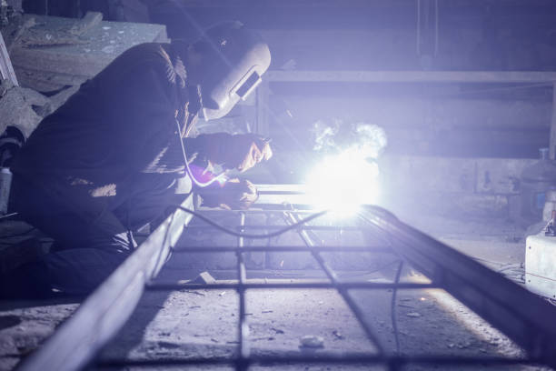 istock Welder works at a factory with metal. 902112900