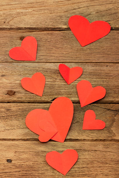 istock Red heart paper on wooden background 902113102