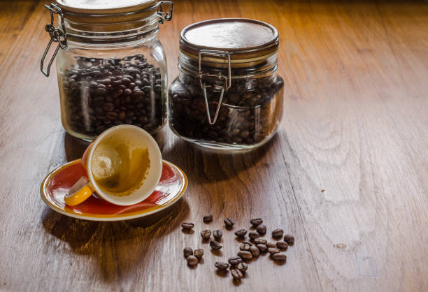istock espresso coffee and roasted coffee beans in glass jar 902120606