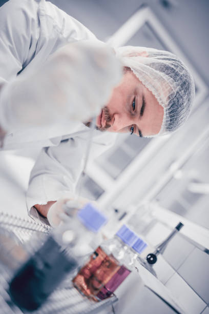 istock Young Energetic Male Tech or Scientist Works in His Laboratory 902124572
