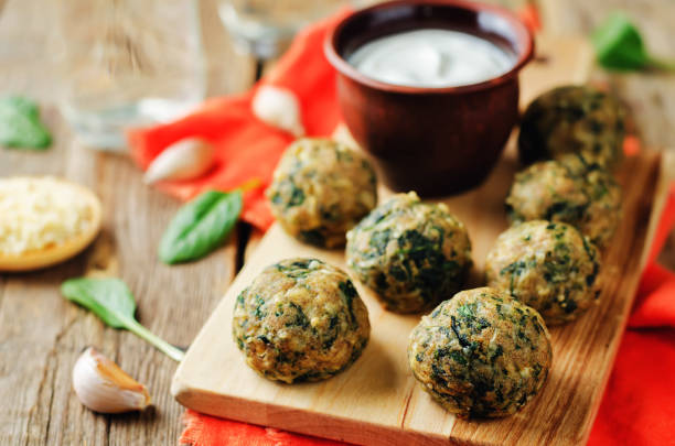 istock Cheese spinach balls with greek yogurt sauce 902124760