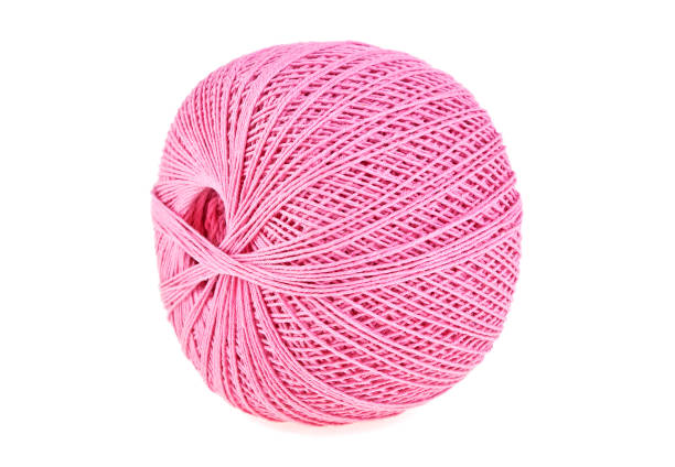 istock Hank of pink thread on a white background 902131624