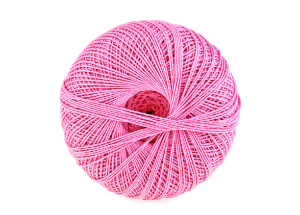 istock Hank of pink thread on a white background 902131638