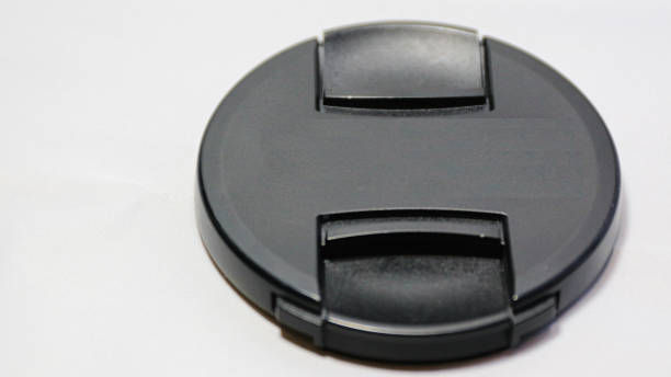 istock lens cap isolated on white background black color 24-70mm 902132654