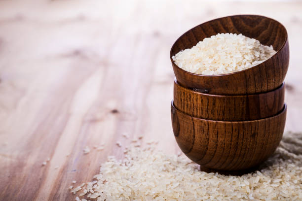 istock Raw rice in a wooden bowl 902132948