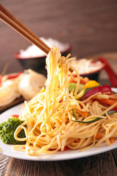 istock fried chinese noodles and vegetables 902133724