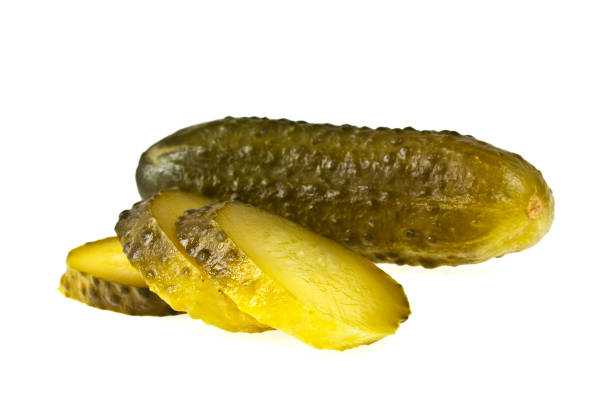 istock Fresh sliced green pickles isolated on white background 902136142