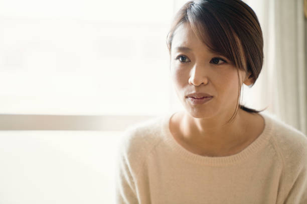istock Woman sitting down on the chair 902137338