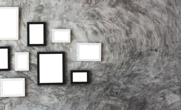 istock white isolated picture frame place on marble wall 902139868